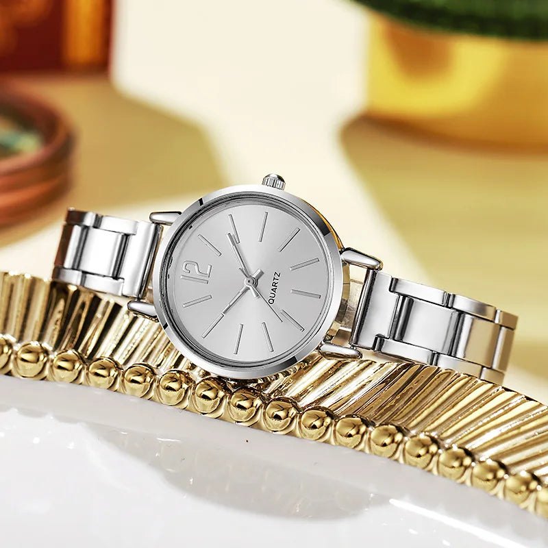 Reloj de lujo mujer – esfera redonda simple y pulsera dorada de acero inoxidable